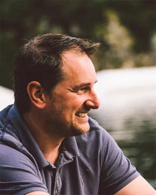 Zac Hillier photographed outdoors beside the water